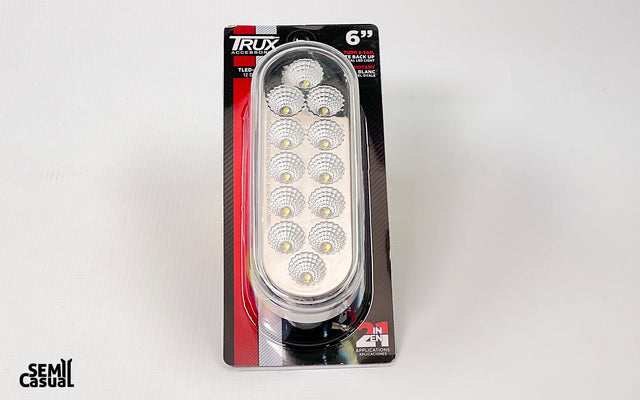 Trux 6″ Red Stop, Turn & Tail to White Back Up LED Oval Light – 12 Diodes