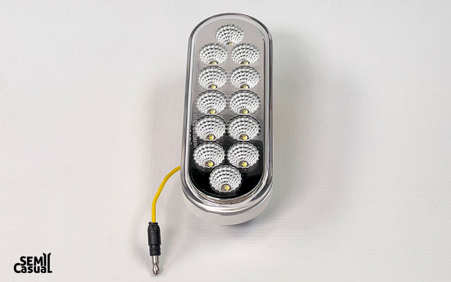 Trux 6″ Red Stop, Turn & Tail to White Back Up LED Oval Light – 12 Diodes